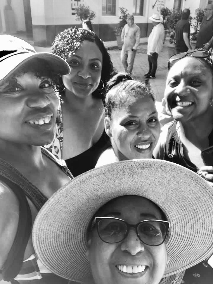 The author, her three sisters and their mother together on holiday.